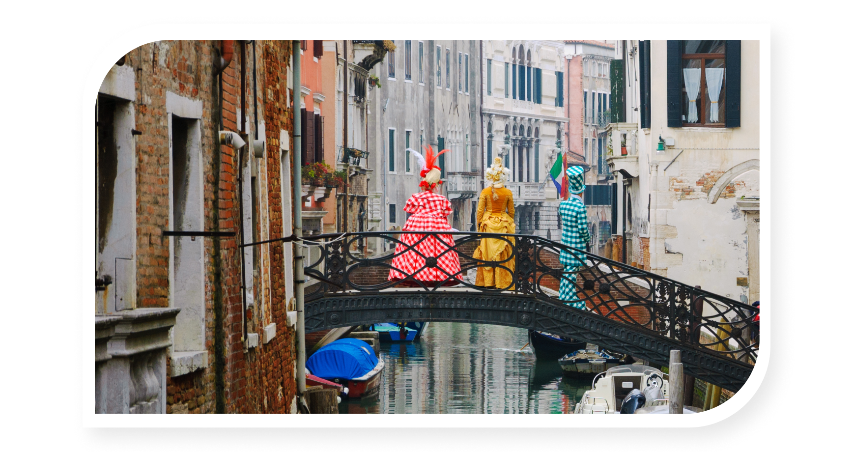 people with costumes standing on the bridge during Venice carnival