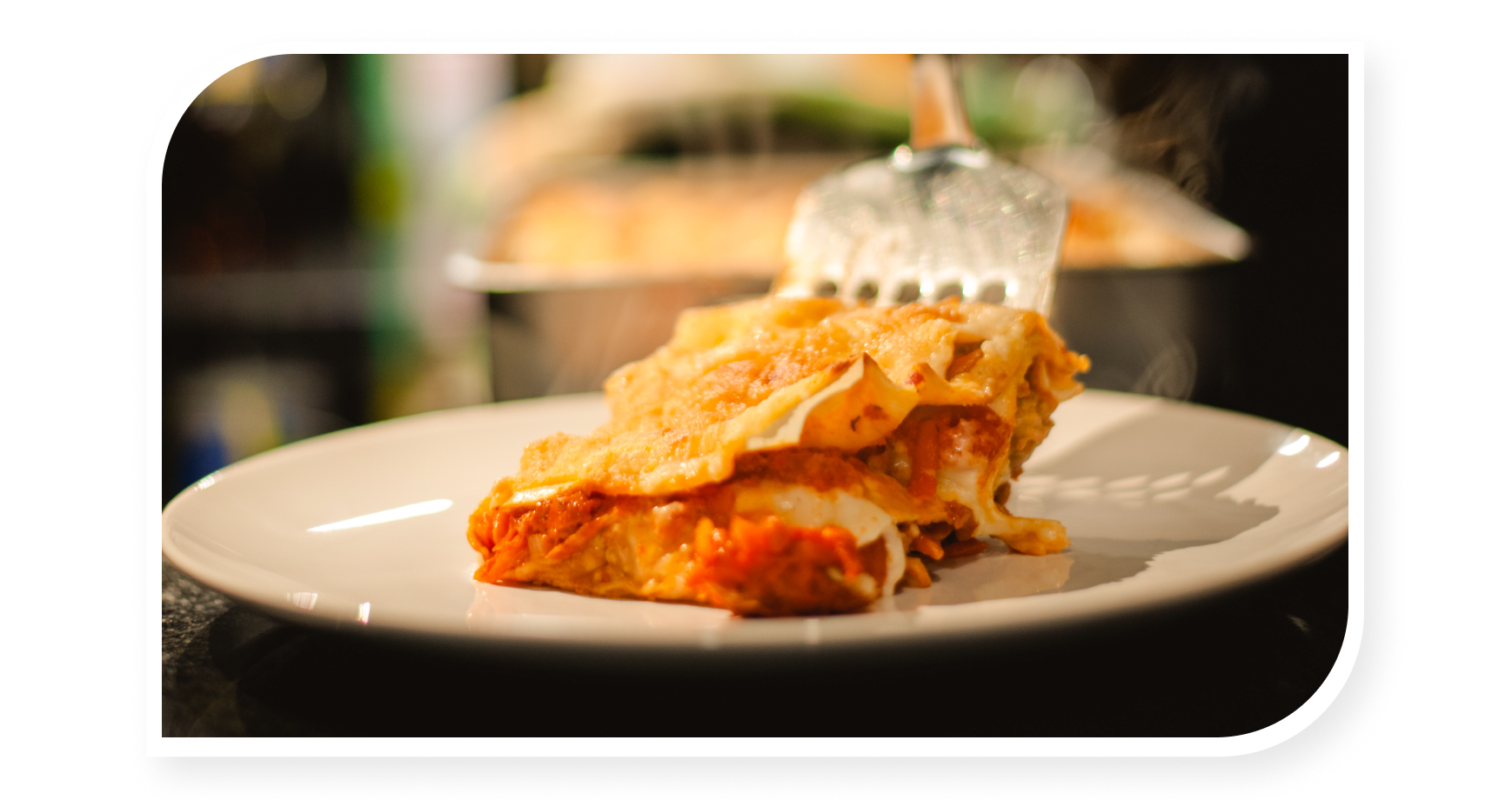Lasagna being served on a plate