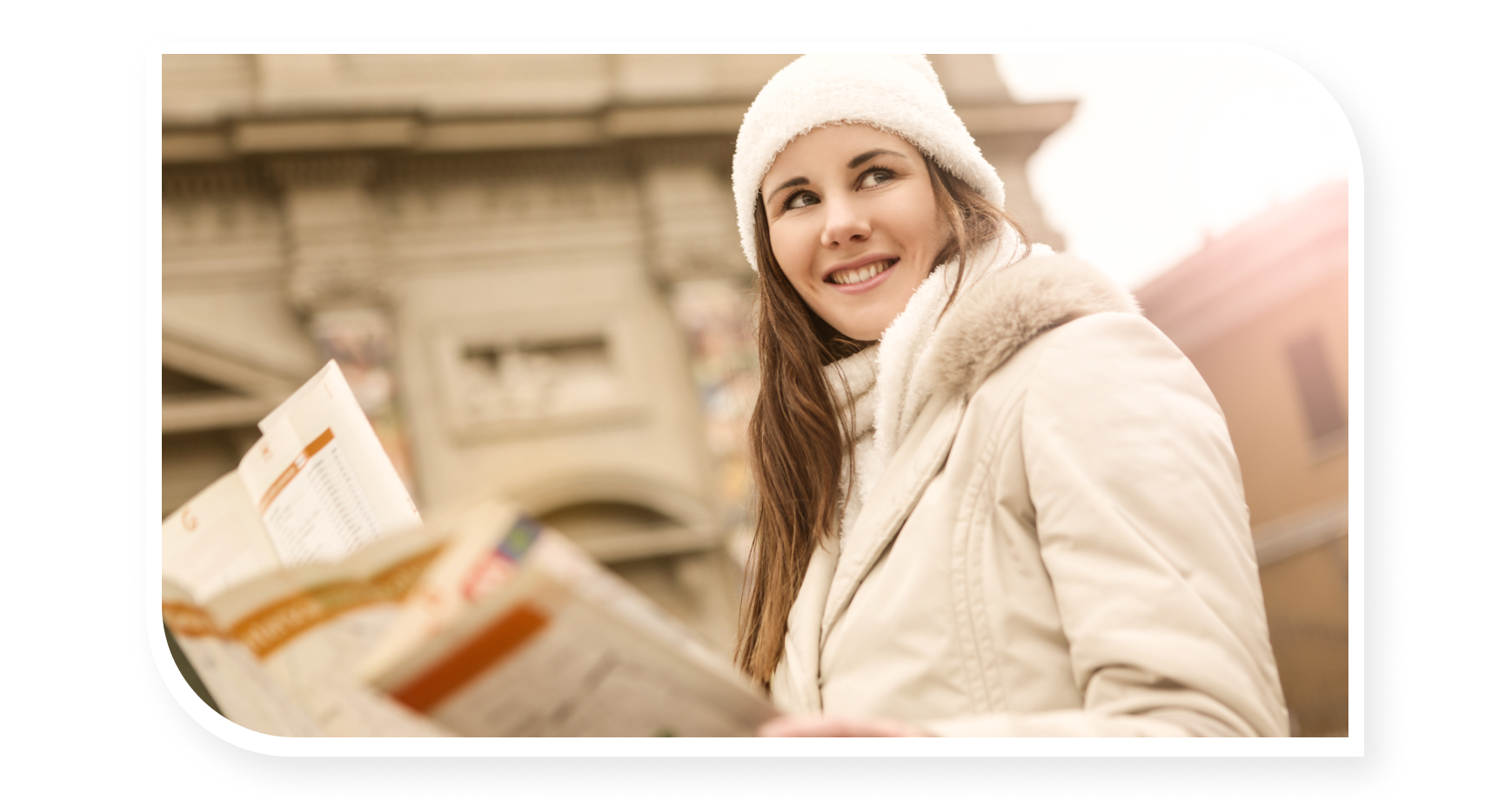 woman holding a map on winter clothing