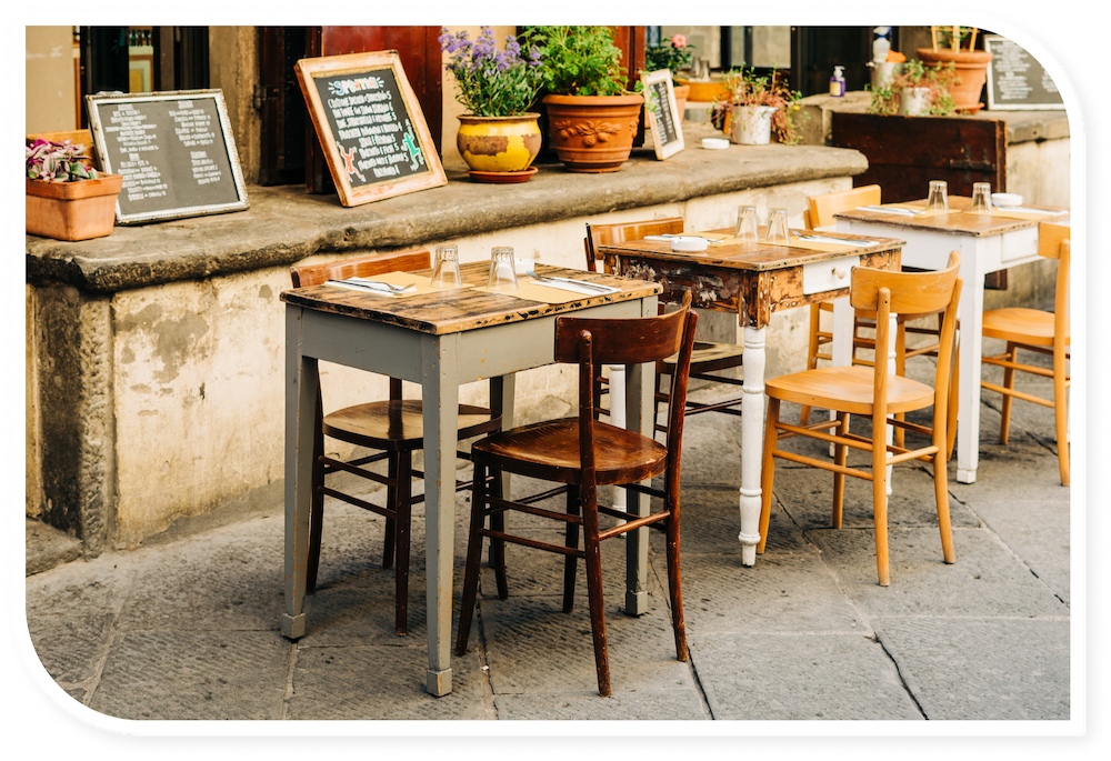 Rustic chairs and tables and one of the charming coffee shops in Verona