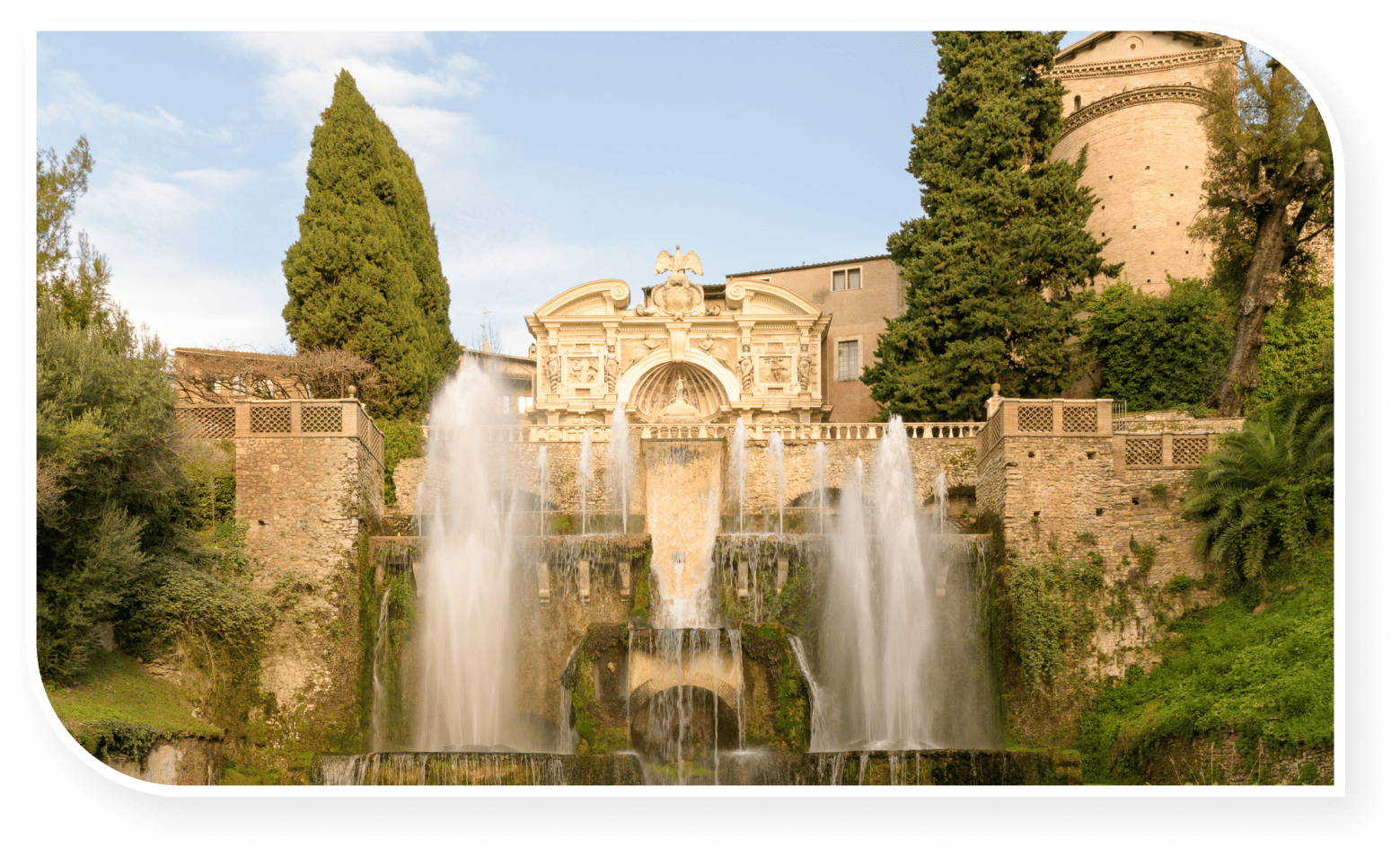 Fountains at Villa d’Este in Tivoli, Italy, with cascading water, lush greenery, and ornate Renaissance architecture in the background.